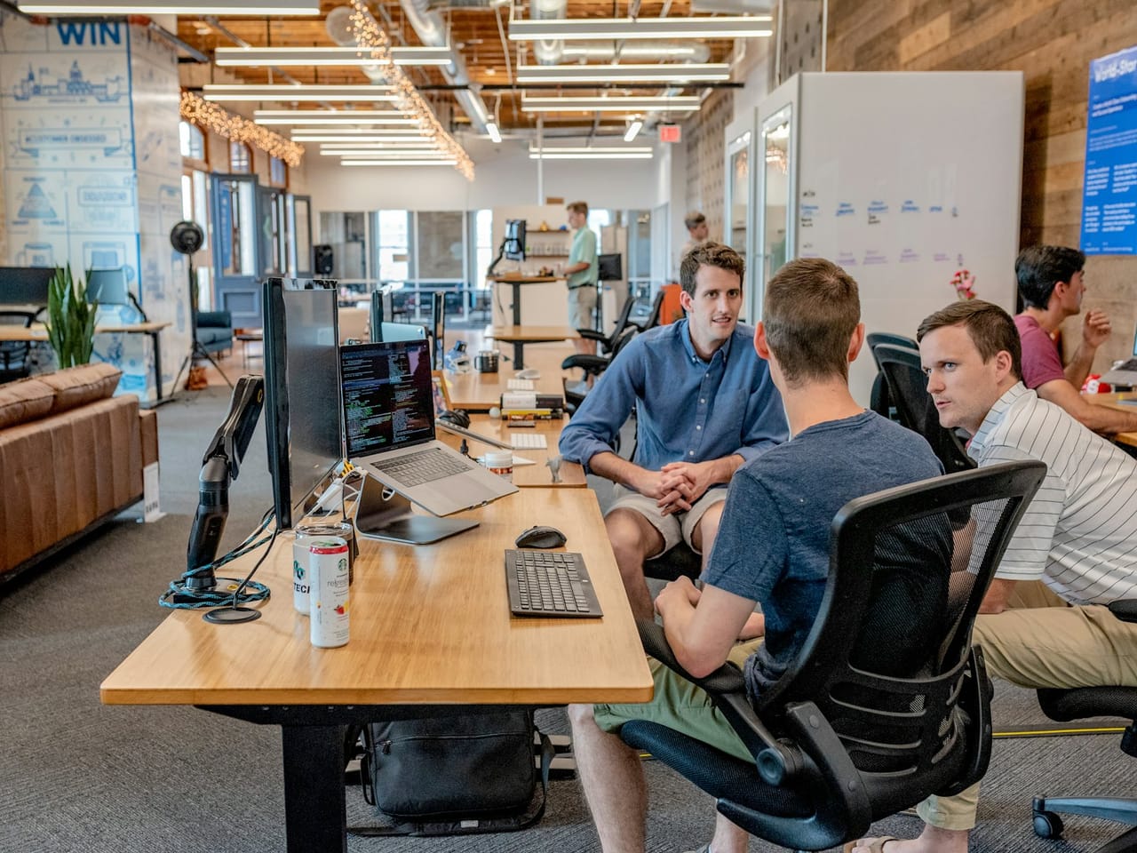 Developers planning their own work together at one desk